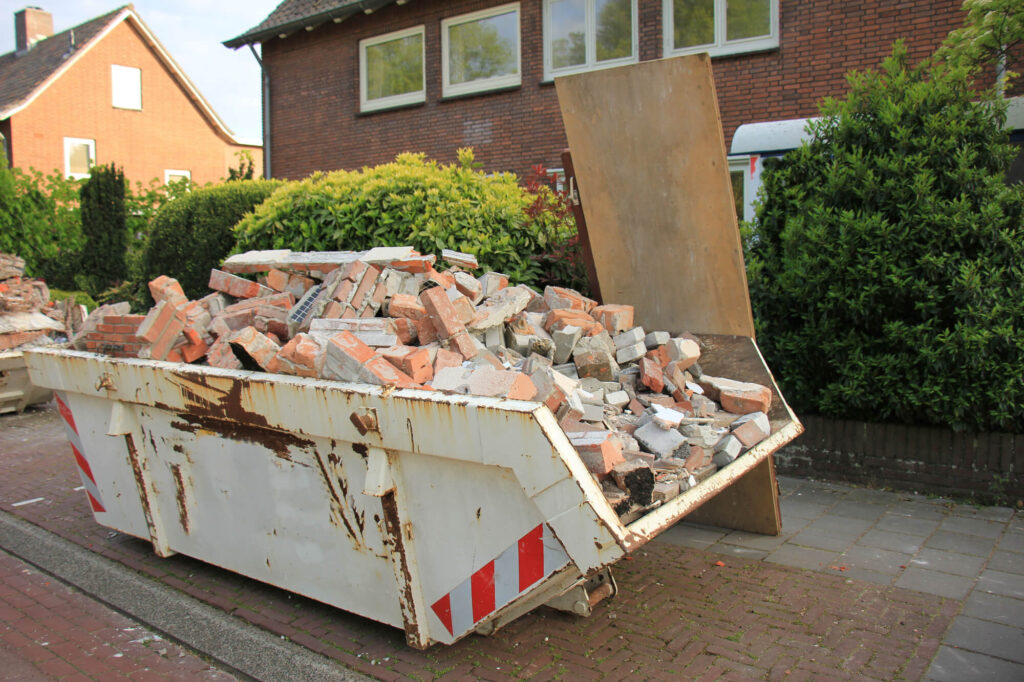 Can Builders Just Dump Building Rubble Adjacent to a Skip on a Road
